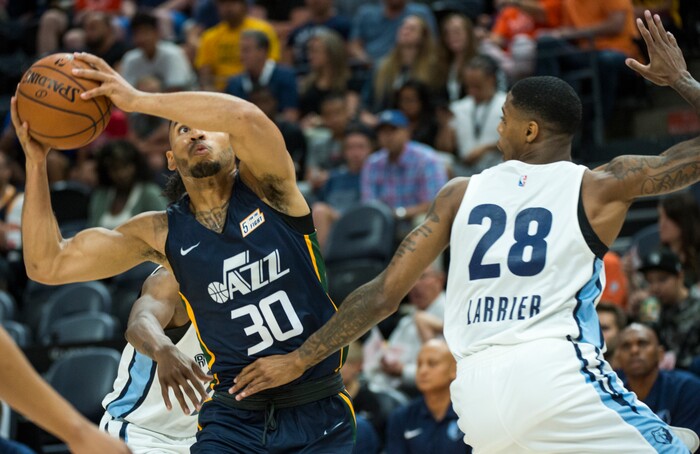 (Rick Egan  |  The Salt Lake Tribune)     Utah Jazz guard Naz Mitrou-Long (30) takes the ball inside as Memphis Grizzlies forward Terry Larrier (28) defends, in Jazz summer league action between Utah Jazz and Memphis Grizzlies in Salt Lake City, Tuesday, July 3, 2018.