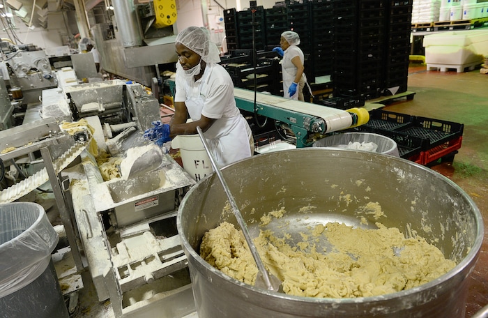 Francisco Kjolseth | The Salt Lake Tribune
Rocky Mountain Pie factor in Salt Lake assembles lemon meringue and apple pies recently. Eight different pies sold through Associated Food Stores, earned blue ribbons in the commercial categories at the National Pie Championships.
