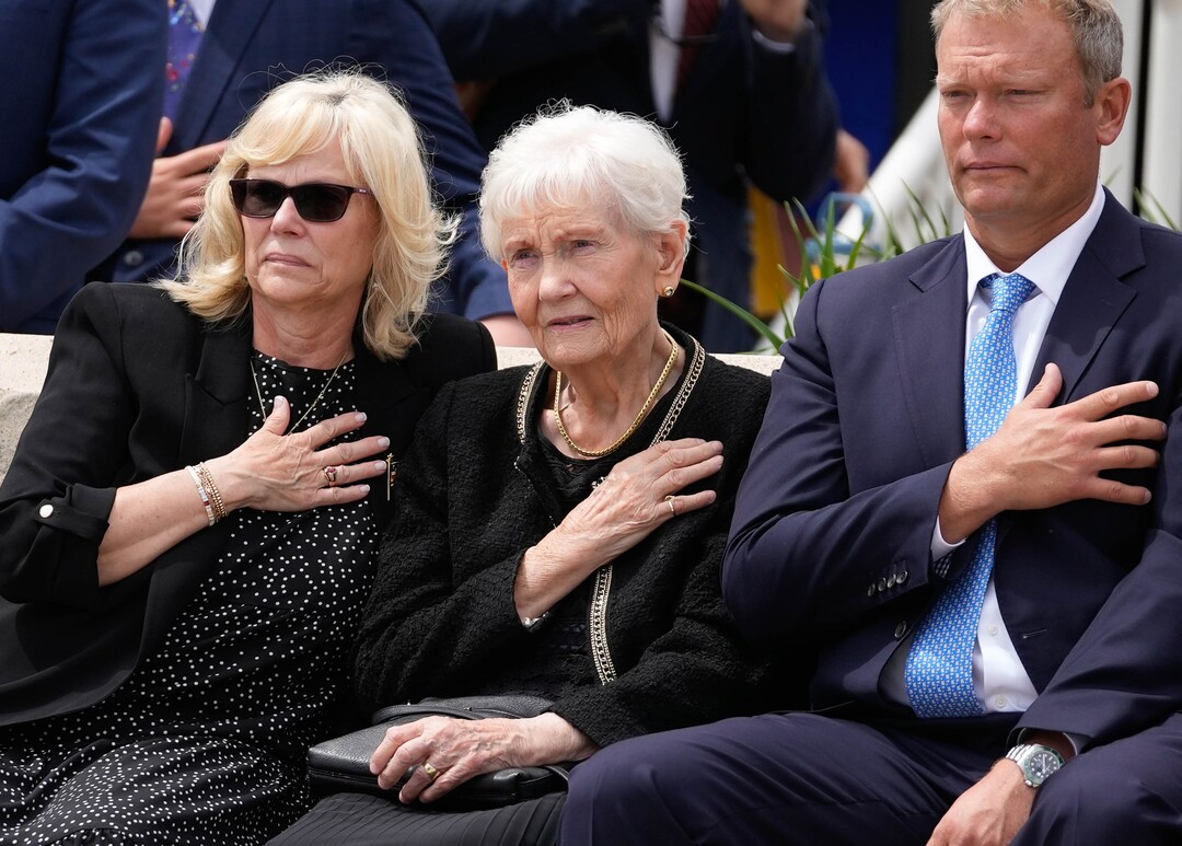 (Francisco Kjolseth | The Salt Lake Tribune) Elaine Hatch, center, wife of former U.S. Senator Orrin Hatch, is joined by her children Marcia Hatch Whetton and Jess Hatch as they watch the flag covering Hatch’s casket be folded following funeral services at The Church of Jesus Christ of Latter-day Saints Institute of Religion in Salt Lake City on Friday, May 6, 2022. Hatch, the longest-serving Republican senator in U.S. history and the longest-serving from Utah, died April 23 at age 88.