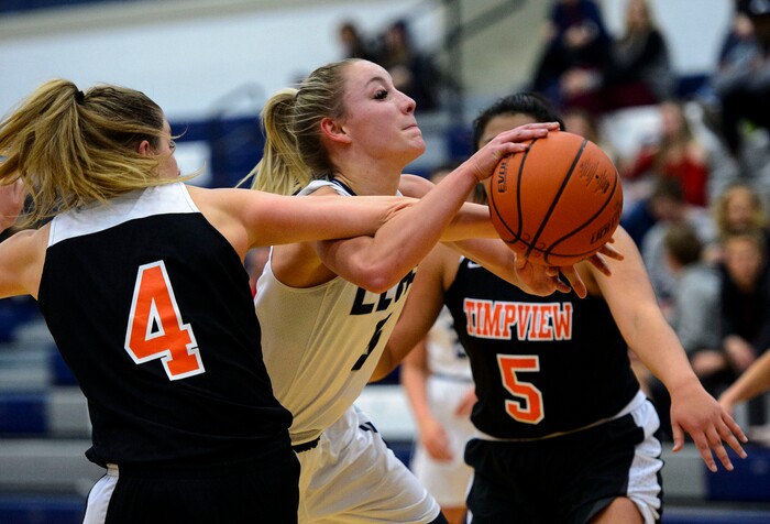 (Steve Griffin  |  The Salt Lake Tribune) Corner Canyon's Nicole Critchfield gets fouled by Timpview's Ella Pope during game at Corner Canyon High School in Draper Tuesday January 16, 2018.