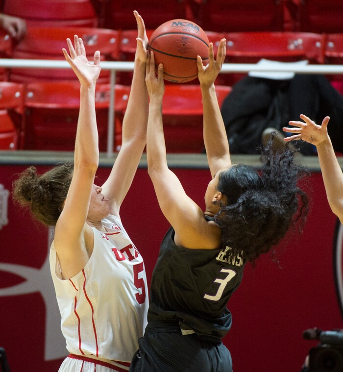(Rick Egan  |  The Salt Lake Tribune)       Washington Huskies forward Mai-Loni Henson (3) takes a shot, as center Megan Huff (5) defends for the Utes, in PAC-12 women's basketball action at the Jon M. Huntsman Center, Sunday, Feb. 18, 2018.