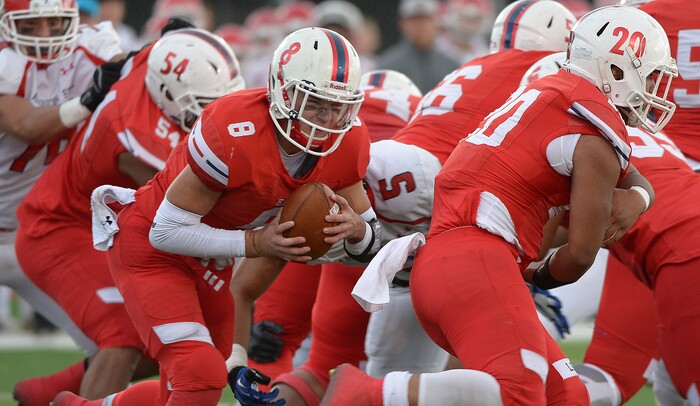 (Leah Hogsten  |  The Salt Lake Tribune) East's quarterback Ben Ford runs for a first down. American Fork High School boys' football team East High School during their class 6A state quarterfinal football game, Friday, November 3, 2017