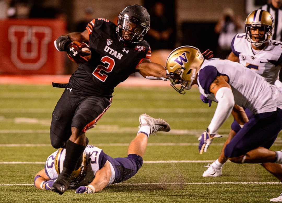 (Trent Nelson | The Salt Lake Tribune)  Utah Utes running back Zack Moss (2) runs the ball as the University of Utah hosts Washington at Rice-Eccles Stadium in Salt Lake City, Saturday Sept. 15, 2018.