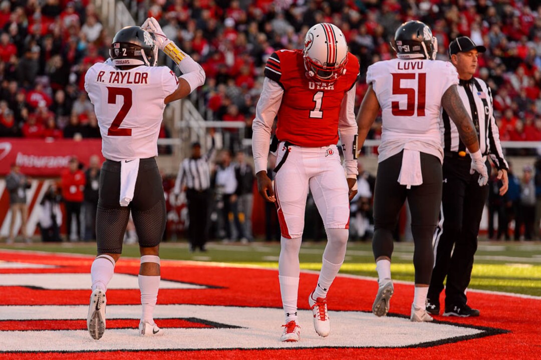 (Trent Nelson | The Salt Lake Tribune)  Utah Utes quarterback Tyler Huntley (1) lowers his head after he was sacked as the University of Utah hosts Washington State, NCAA football in Salt Lake City, Saturday November 11, 2017.
