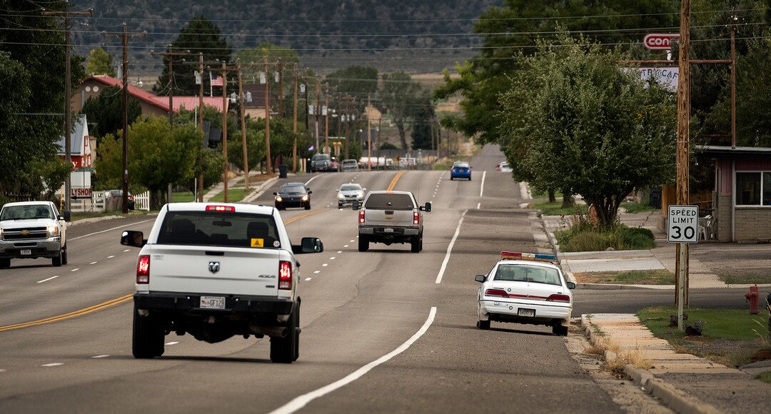 (Leah Hogsten  |  The Salt Lake Tribune) Parked on the shoulder of Highway 24, Wayne County sheriff's "deputy" Parker Doolittle deters would be speeders in the small town of Loa, Utah, Sept. 13, 2017.
