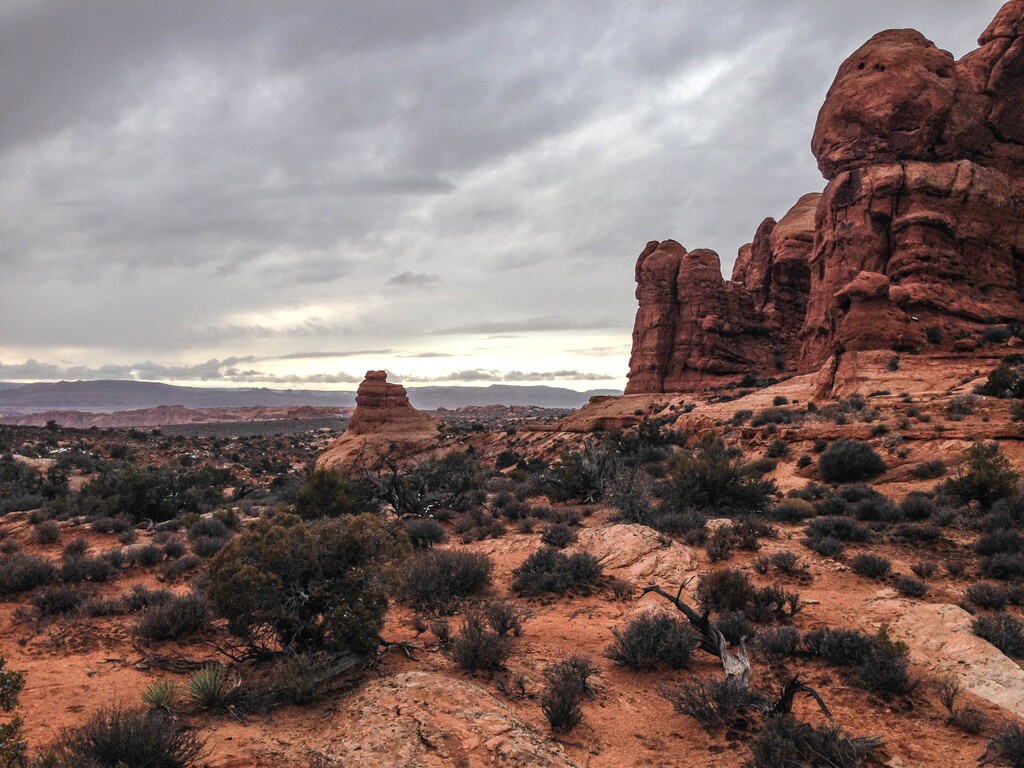 (Erin Alberty  |  The Salt Lake Tribune) Sunlight emerges under a steely sky Nov. 29, 2015 near the road to Delicate Arch in Arches National Park.
