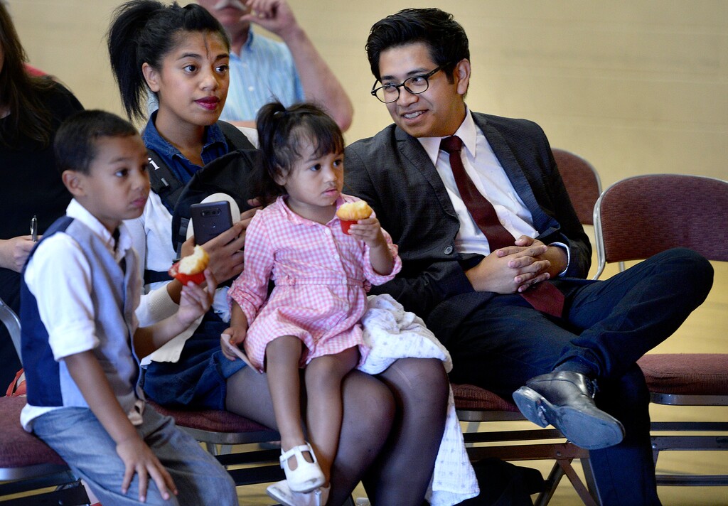(Scott Sommerdorf | The Salt Lake Tribune) "Dreamer" and activist Deyvid Morales sits with his family before speaking at the #SummerResistance Day of Action: Protecting DACA rally put on by the Utah State Democratic Party and Utah State Democratic Hispanic Caucus at the Centro Civico Mexicano, Sunday, Aug. 20, 2017. From left: "Mafi" Sili, 4; wife Siosiani Sili; "Lala" Morales, 2; Manny Morales (in Siosiani's arms); and Deyvid Morales, right.