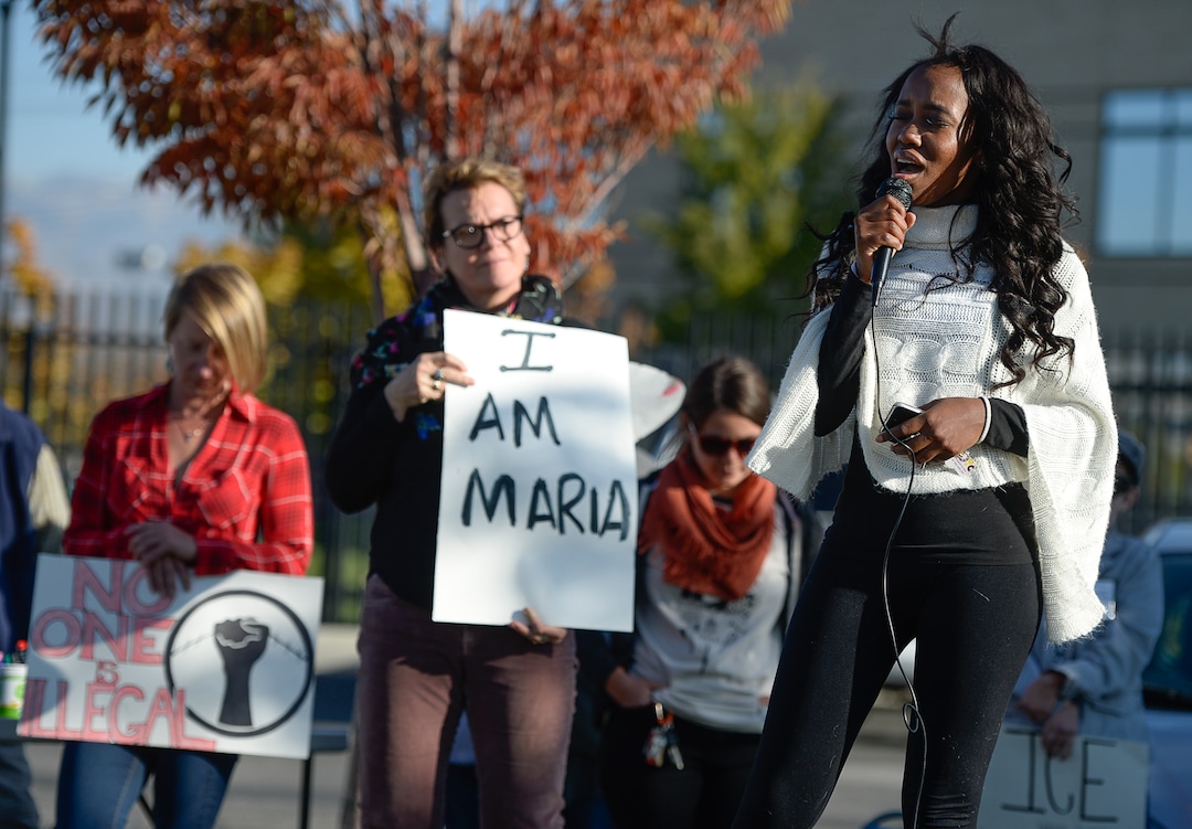 (Francisco Kjolseth  |  The Salt Lake Tribune)  Christina Mohlakola sings the national anthem and then exclaims "this country has forgotten what it stands for, the home of the brave and free" as she joins community members rallying in support Maria Santiago Garcia, a single Utah mother of four U.S. born children who faces an impending deportation order.