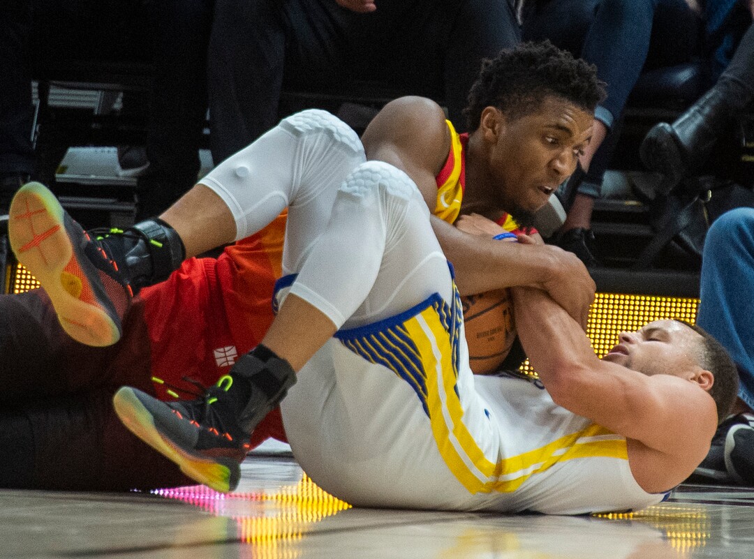 (Rick Egan  |  The Salt Lake Tribune)  Utah Utah Jazz guard Donovan Mitchell (45) goes for a loose ball along with Golden State Warriors guard Stephen Curry (30), in NBA action between Utah Jazz and Golden State Warriors, in Salt Lake City, Wednesday, Dec. 19, 2018.