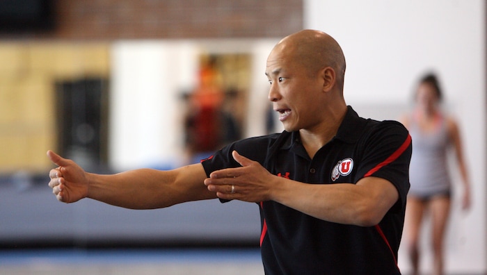 Steve Griffin |  Tribune file photoUniversity of Utah assistant coach Tom Farden works with gymnasts during practice at the Utah gymnastics practice facility on the campus of the University of Utah in Salt Lake City Friday March 30, 2012.
