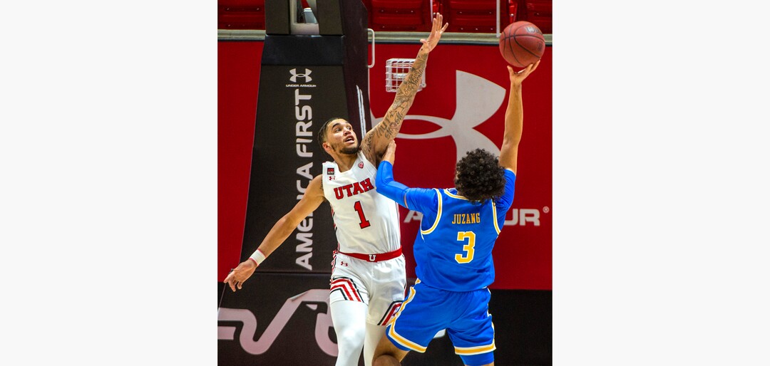 (Rick Egan | The Salt Lake Tribune) Utah Utes forward Timmy Allen (1) defends, as UCLA guard Johnny Juzang (3) shoots for the Bruins, in PAC-12 basketball action at the Jon M. Huntsman Center, on Thursday, Feb. 25, 2021.