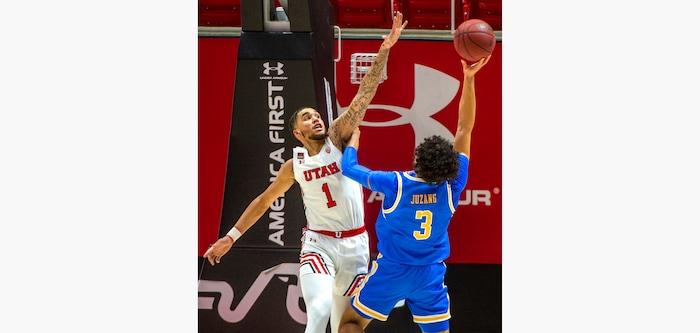 (Rick Egan | The Salt Lake Tribune) Utah Utes forward Timmy Allen (1) defends, as UCLA guard Johnny Juzang (3) shoots for the Bruins, in PAC-12 basketball action at the Jon M. Huntsman Center, on Thursday, Feb. 25, 2021.