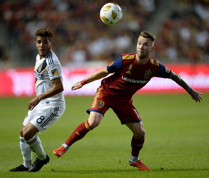 (Francisco Kjolseth  |  The Salt Lake Tribune)  Los Angeles Galaxy forward Ola Kamara (11) battles Real Salt Lake midfielder Sunday Stephen (8) during the first half of the MLS soccer match Saturday, Sept. 1, 2018, in Sandy at Rio Tinto Stadium.