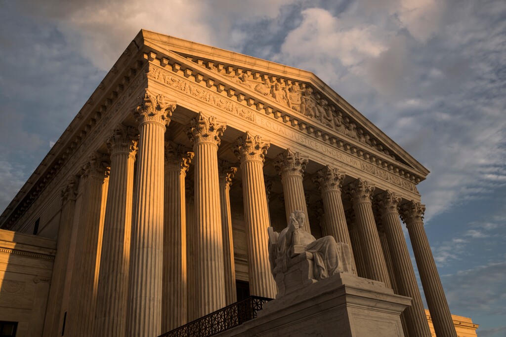 (J. Scott Applewhite | The Associated Press) In this Oct. 10, 2017, file photo, the Supreme Court in Washington, at sunset.
