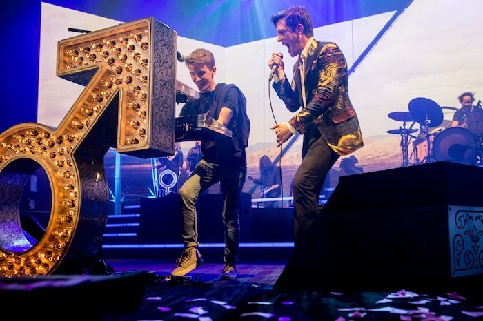 (Photo courtesy of Rob Loud/@robloud) Frontman Brandon Flowers, right, of The Killers performs at Vivint Smart Home Arena in Salt Lake City on Tuesday, Feb. 6, 2018. "Eli from Kaysville," at left, was plucked from the crowd to play a piano part on "A Dustland Fairytale."