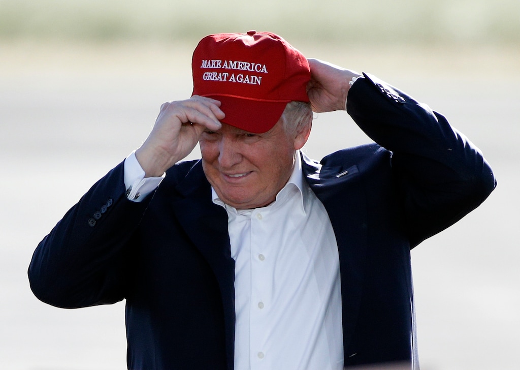 FILE - In this June 1, 2016, file photo, Republican presidential candidate Donald Trump wears his "Make America Great Again" hat at a rally in Sacramento, Calif. Hats with the now popular slogan is a possible gift idea for this holiday season. (AP Photo/Jae C. Hong, File)