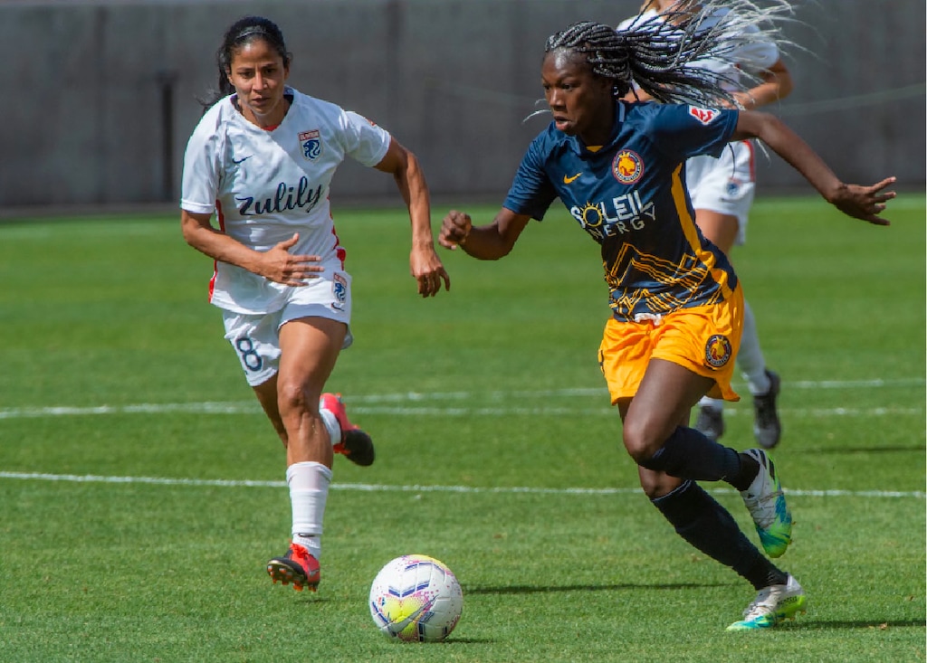(Rick Egan | The Salt Lake Tribune) Utah Royals FC midfielder Aminata Diallo takes the ball downfield as midfielder Shirley Cruz defends for Ol Reign FC, in soccer action between Utah Royals FC and Ol Reign FC at Rio Tinto Stadium in Sandy, Saturday, Sept. 26, 2020.