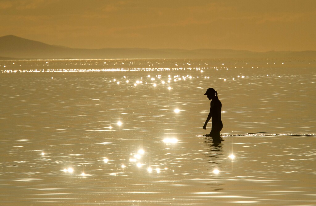 (Rick Egan  |  The Salt Lake Tribune)    Mary Brooks from Missoula, Montana, wades in the Great Salt Lake, Sept. 18, 2019.