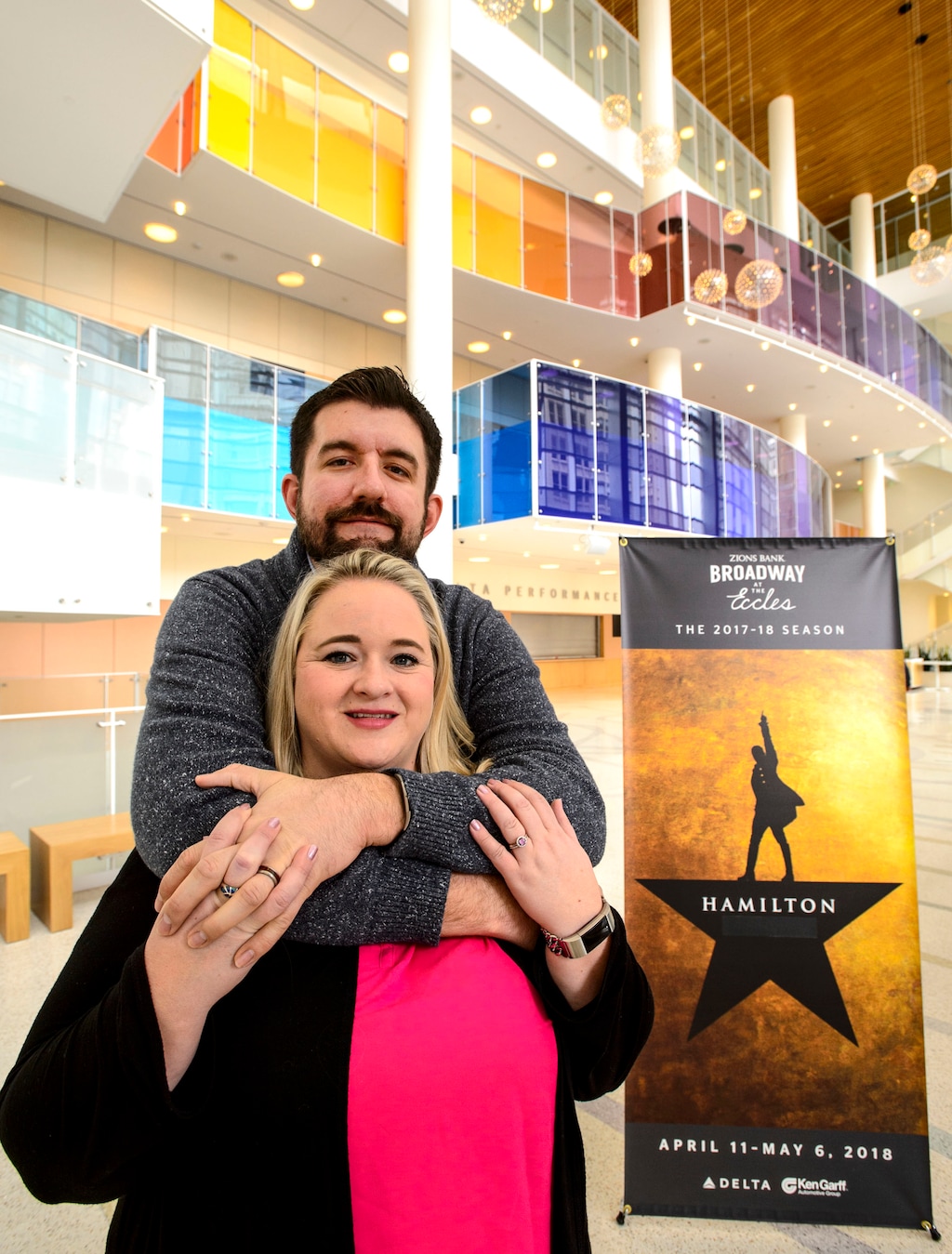 (Steve Griffin  |  The Salt Lake Tribune)  Shannon and Colt Herrera, who are "Hamilton" superfans, in front of a "Hamilton" poster in the Eccles Theater lobby in Salt Lake City Friday April 6, 2018. Shannon booked her "Hamilton" tickets for her New York honeymoon before she booked the venue for her wedding.
