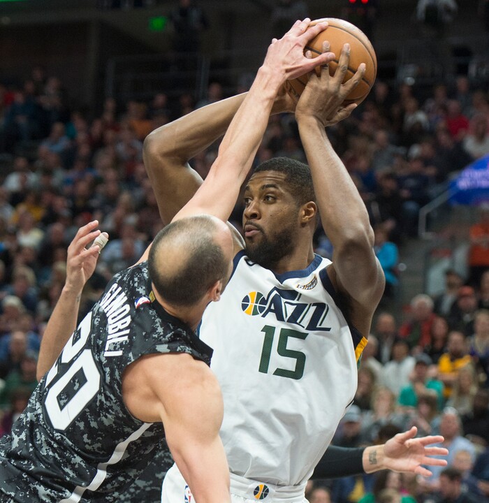 (Rick Egan  |  The Salt Lake Tribune)   Utah Jazz forward Derrick Favors (15) looks for a shot, as San Antonio Spurs guard Manu Ginobili (20) defends, in NBA action, in Salt Lake City, Monday, February 12, 2018.


