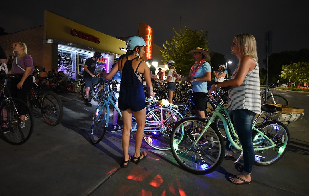 (Francisco Kjolseth  |  The Salt Lake Tribune)  A large group of cyclist gathers on the corner of 9th and 9th at 9pm in Salt Lake City on Thursday, July 26, 2018, for the weekly ride that has become known as the 999 Ride. The inclusive, all-welcoming slow casual social ride happens year round on Thursday nights, with riders often pedaling into the early morning hours. Newly released video shows rider Cameron Hooyer being struck and killed by a FrontRunner train at a downtown railroad crossing during last weeks ride when the 22-year-old failed to stop or heed the warning signals before crossing the tracks during the group ride. 