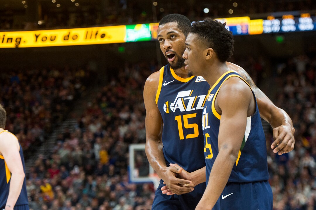(Rick Egan  |  The Salt Lake Tribune)   Utah Jazz forward Derrick Favors (15) tries to keep Utah Jazz guard Donovan Mitchell (45) calm after he was called for a foul as he defended against Cleveland Cavaliers forward LeBron James (23), in NBA action Utah Jazz vs Cleveland Cavaliers, in Salt Lake City,  Saturday, December 30, 2017.