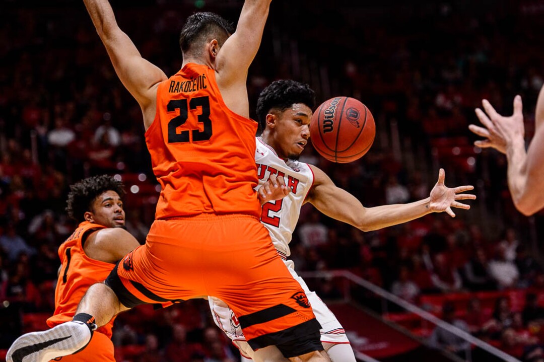 (Trent Nelson | The Salt Lake Tribune)  Utah Utes guard Sedrick Barefield (2) drives around Oregon State Beavers center Gligorije Rakocevic (23) as Utah hosts Oregon State, NCAA basketball in Salt Lake City on Saturday Feb. 2, 2019. At left is Oregon State Beavers guard Stephen Thompson Jr. (1).