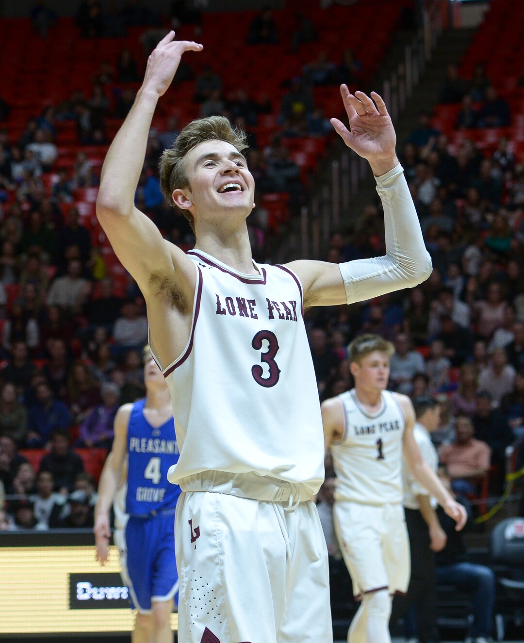 (Leah Hogsten  |  The Salt Lake Tribune) Lone Peak's Steven Ashworth (03) starts celebrating with the booster section before the game ends. Lone Peak defeated Pleasant Grove 61-44 to win the 6A High School Boys’ Basketball Tournament Championship at the Jon M. Huntsman Center in Salt Lake City, Saturday, March 3, 2018. 