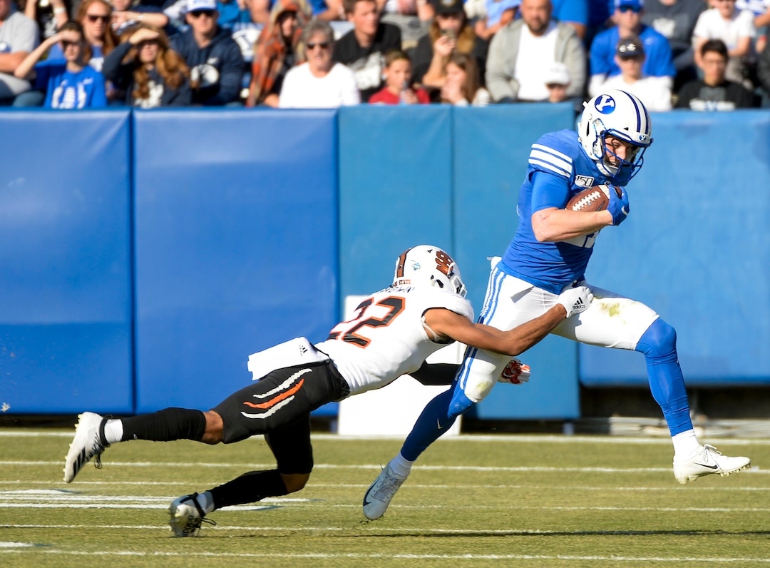 (Leah Hogsten  |  The Salt Lake Tribune) Brigham Young Cougars wide receiver Talon Shumway (21) slips past Idaho State Bengals defensive back Caleb Brown (22) for the first down as Brigham Young University takes on Idaho State, Saturday, Nov. 16, 2019 at LaVell Edwards Stadium.