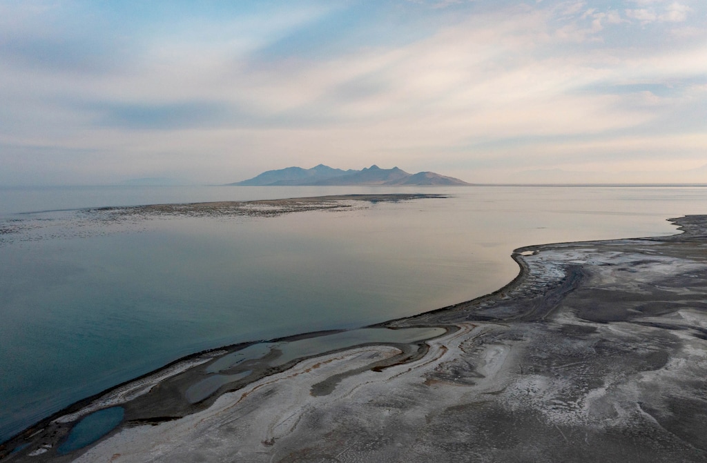 (Francisco Kjolseth | The Salt Lake Tribune) An unusual sight emerges from the shallow waters of the Great Salt Lake as a “reef” pops into view between Saltair and Antelope Island on July 10, 2021, as extreme drought conditions impact the lake. Two Utah congressman are working to conserve saline waters, including the lake, throughout the West before they become environmental and public health disasters.