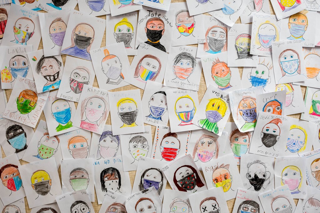 (Trent Nelson  |  The Salt Lake Tribune) Self-portraits of students wearing masks hang on a wall at Crescent Elementary in Sandy on Thursday, Dec. 10, 2020. As Utah school districts struggled to make the most of the pandemic school year, they’ve come away some innovations that are expected to stay long after the coronavirus has subsided.