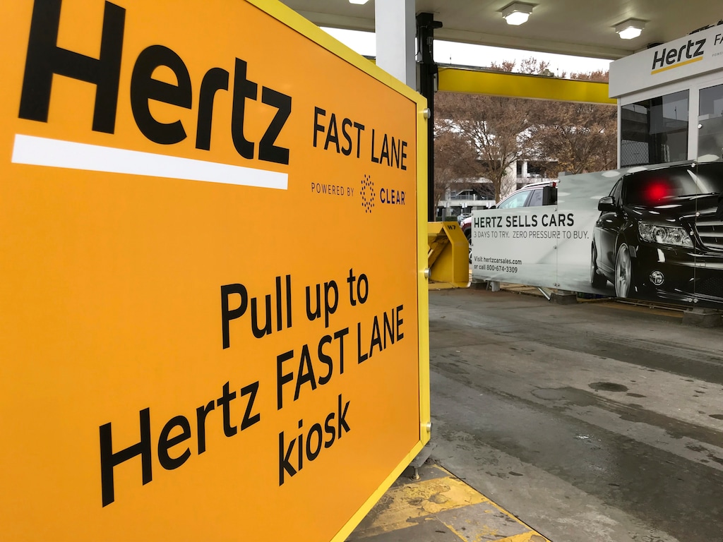 (Jeff Martin | AP file photo) A Hertz "Fast Lane" sign directs rental car drivers to a biometric scanning machine at Hartsfield-Jackson Atlanta International Airport, in Atlanta on Dec. 7, 2018.