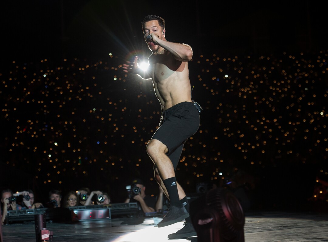 (Rick Egan  |  The Salt Lake Tribune)     Dan Reynolds performs with Imagine Dragons, at the Loveloud Festival at Rice-Eccles Stadium, Saturday, July 28, 2018.