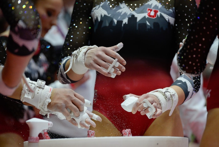 (Francisco Kjolseth  |  The Salt Lake Tribune)  Chalking up before the bars routine Utah hosts Penn State in their season opener at the Huntsman Center in Salt Lake City on Saturday, Jan. 5, 2019.