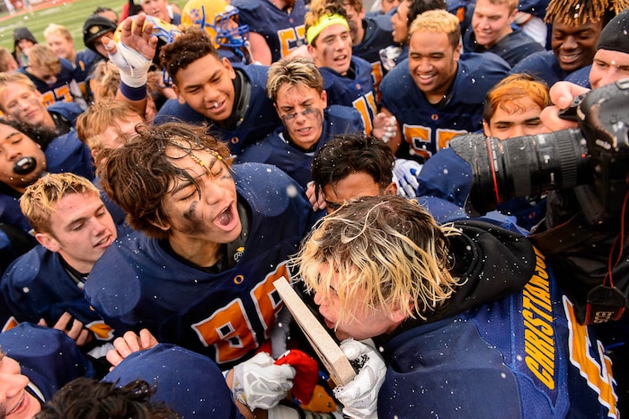 (Trent Nelson | The Salt Lake Tribune)  Orem players celebrate the win over Mountain Crest in the Class 4A High School State Football Championship game in Salt Lake City, Friday November 17, 2017.