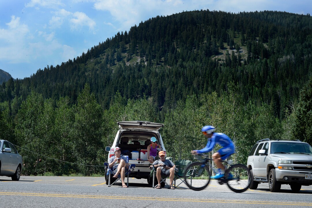 (Scott Sommerdorf   |  The Salt Lake Tribune)   Fans who set up their chairs near the Silver Fork Grill watch riders pass as they keep track on the race app during Stage 3 of the Tour of Utah in Big Cottonwood Canyon, Wednesday, August 2, 2017.  