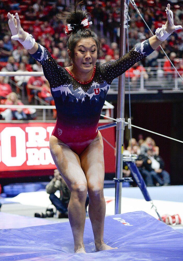 (Francisco Kjolseth  |  The Salt Lake Tribune)  Crystal Isa nails her landing off the bars as Utah hosts Penn State in their season opener at the Huntsman Center in Salt Lake City on Saturday, Jan. 5, 2019.