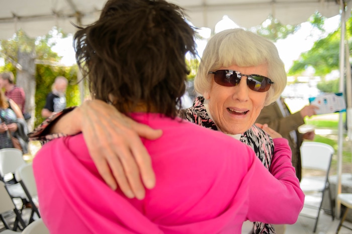 (Trent Nelson  |  The Salt Lake Tribune)
Pamela Atkinson embraces a resident of Palmer Court in Salt Lake City on Thursday June 13, 2019. The Road Home celebrated the 10-year anniversary of Palmer Court.