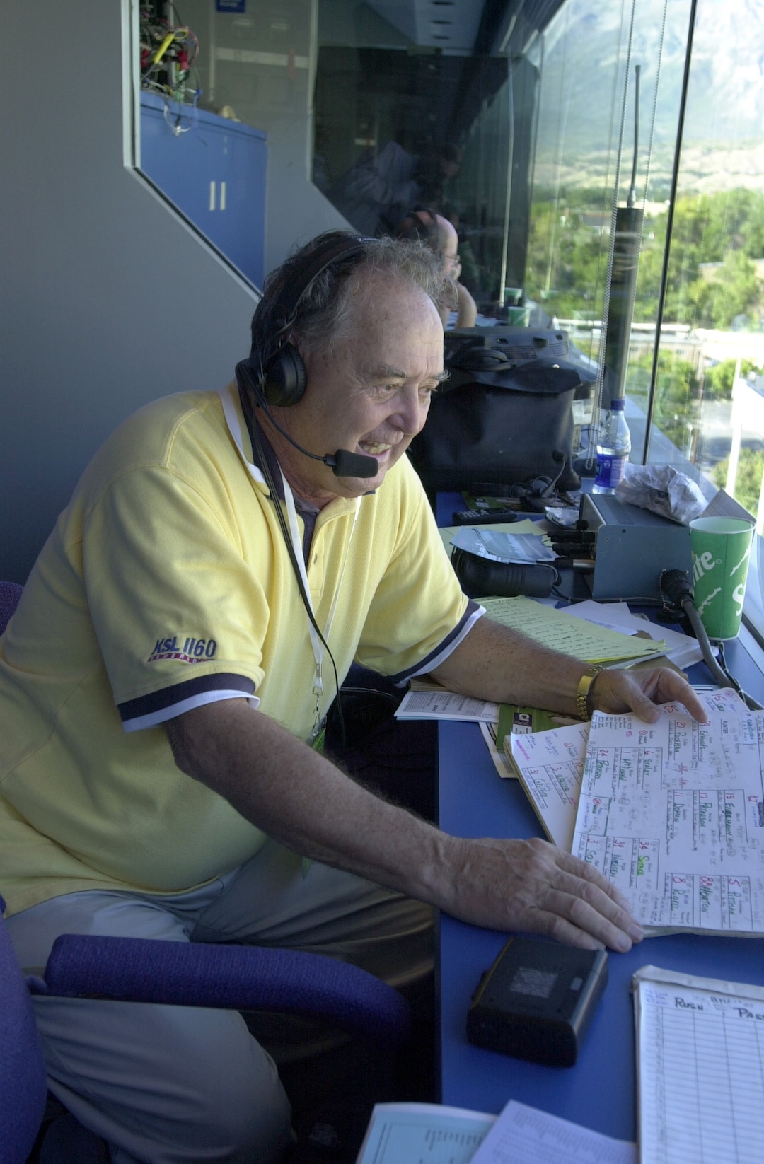 (Photo courtesy BYU) BYU sports play-by-play broadcaster Paul James calls a game from the press box at Lavell Edwards Stadium in 2000. James died Oct. 6, 2018. He was 87.