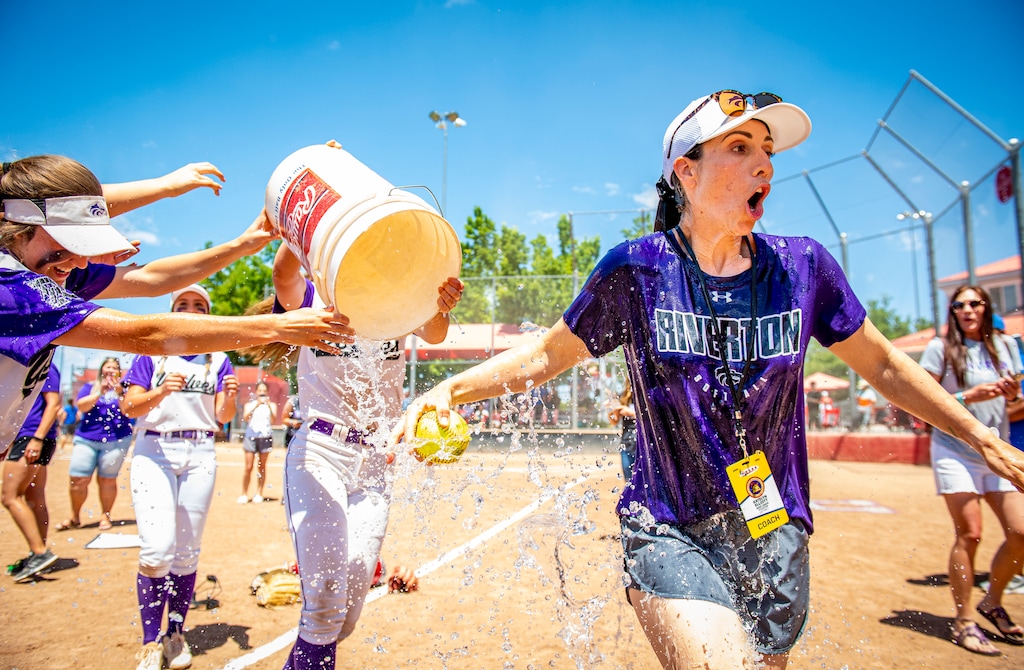 (Isaac Hale | Special to The Tribune) Riverton players douse head coach Katelyn Elliott with water after the Silverwolves won the 6A state softball championship in 2021. On Friday, Elliott and the Silverwolves repeated as state champs.