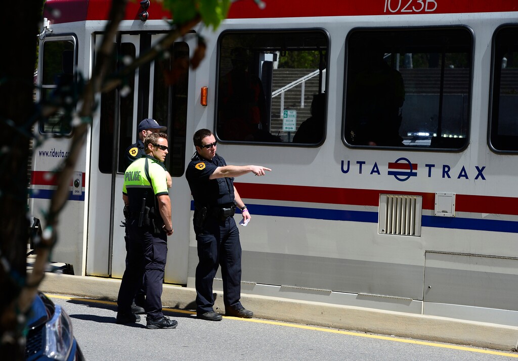 (Scott Sommerdorf | Tribune file photo)
Police, Fire and TRAX personnel inspect the scene where a pedestrian apparently attacked a TRAX train on 400 West, near The Gateway shopping center, Wednesday, April 20, 2016.