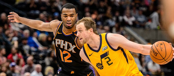 (Trent Nelson | The Salt Lake Tribune)  Utah Jazz forward Joe Ingles (2) drives on Phoenix Suns forward TJ Warren (12) as the Utah Jazz host the Phoenix Suns, NBA basketball in Salt Lake City, Wednesday Feb. 14, 2018.