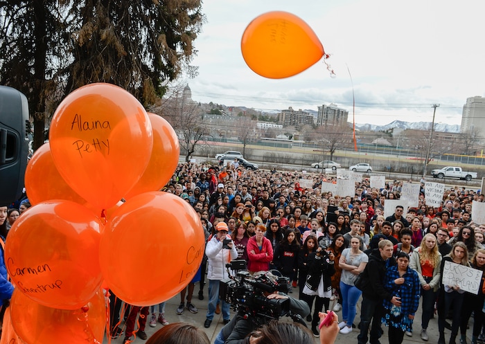 (Francisco Kjolseth  |  The Salt Lake Tribune)  Balloons representing the 17 killed in last month's mass shooting at Marjory Stoneman Douglas High School in Parkland, Fla., are released by West High School students in Salt Lake, during a student walkout on Wed. March 14, 2018. Students in Utah and around the country planned the large-scale coordinated demonstration to protest gun violence. 