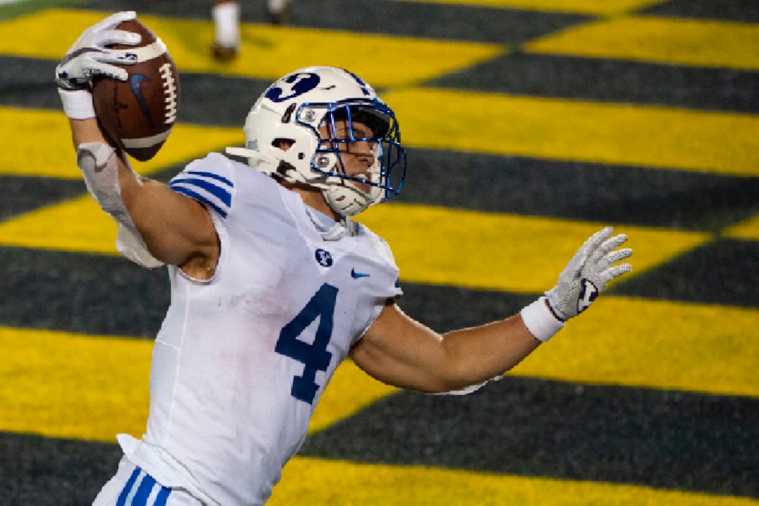 BYU running back Lopini Katoa (4) reacts after scoring a touchdown during the first half of an NCAA college football game against Navy, Monday, Sept. 7, 2020, in Annapolis, Md. (AP Photo/Tommy Gilligan)