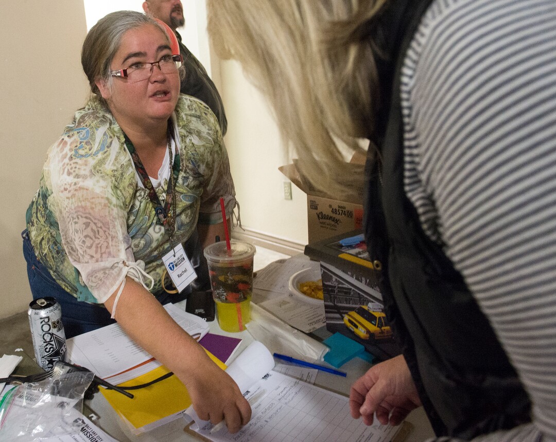 (Rick Egan  |  The Salt Lake Tribune)     Rachel Vaughan, a Disciple with the Salt Lake City Mission, checks in volunteers, at the 25th annual Thanksgiving Dinner for the hungry and homeless, at the Christian Life Center, on Redwood Road in Salt Lake City, Wednesday, Nov. 21, 2018.