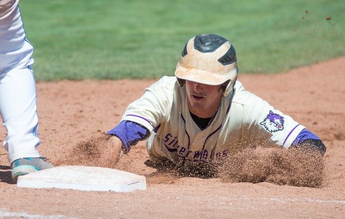(Rick Egan  |  The Salt Lake Tribune)  Ryen Edwards dives back to first safely for Riverton, in 6A state baseball championship action between Riverton and Bingham, at UVU in Orem, Friday, May 25, 2018.