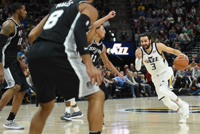 (Francisco Kjolseth  |  The Salt Lake Tribune)  Utah Jazz guard Ricky Rubio (3) faces down the Spurs defense during the first half of the NBA basketball game in Salt Lake City, Thursday, Dec. 21, 2017.