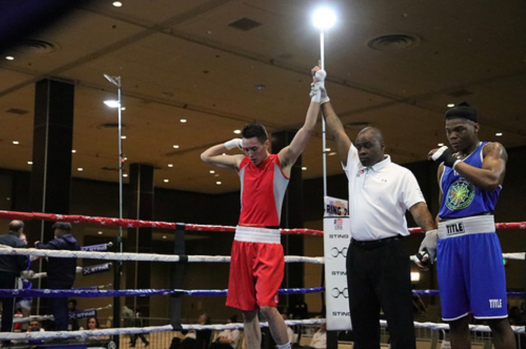 (Photo courtesy of Lights Out Boxing Gym) Clearfield boxer Jon Bryant (left) claims a victory in a recent amateur boxing tournament. Bryant has advanced to the national Golden Gloves semifinals in Chattanooga, Tenn., this week.