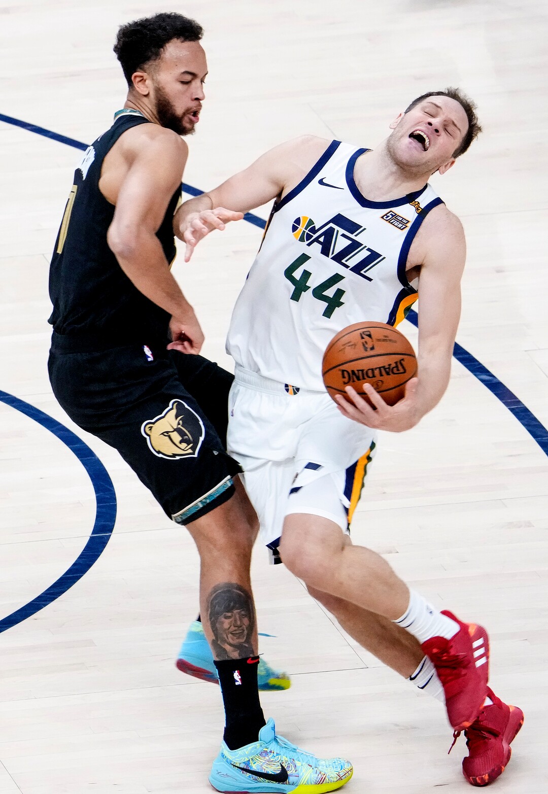 (Leah Hogsten | The Salt Lake Tribune) Utah Jazz forward Bojan Bogdanovic (44) is fouled by Memphis Grizzlies forward Kyle Anderson (1)  as the Utah Jazz take on the Memphis Grizzlies during Game 1 of the first-round playoffs at Vivint Arena, May 23, 2021.
