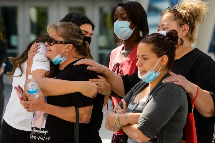 (Trent Nelson | The Salt Lake Tribune) Bobbie Santiago, mother of Riche Antonio Santiago, is embraced by Jeanette Padilla at a rally against police brutality at the Public Safety Building in Salt Lake City on Saturday, Aug. 15, 2020.